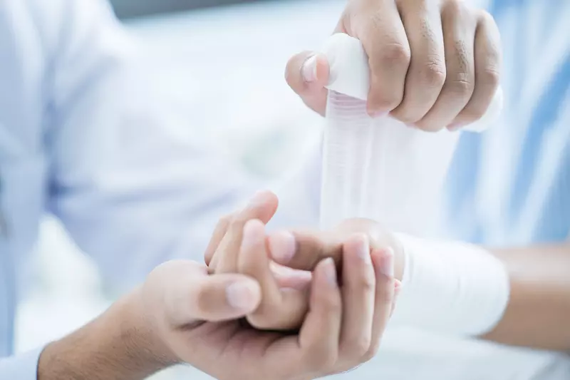 pharmacist wrapping hurt wrist