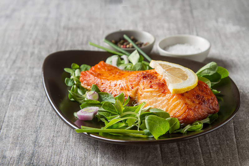 grilled salmon on a bed of lettuce