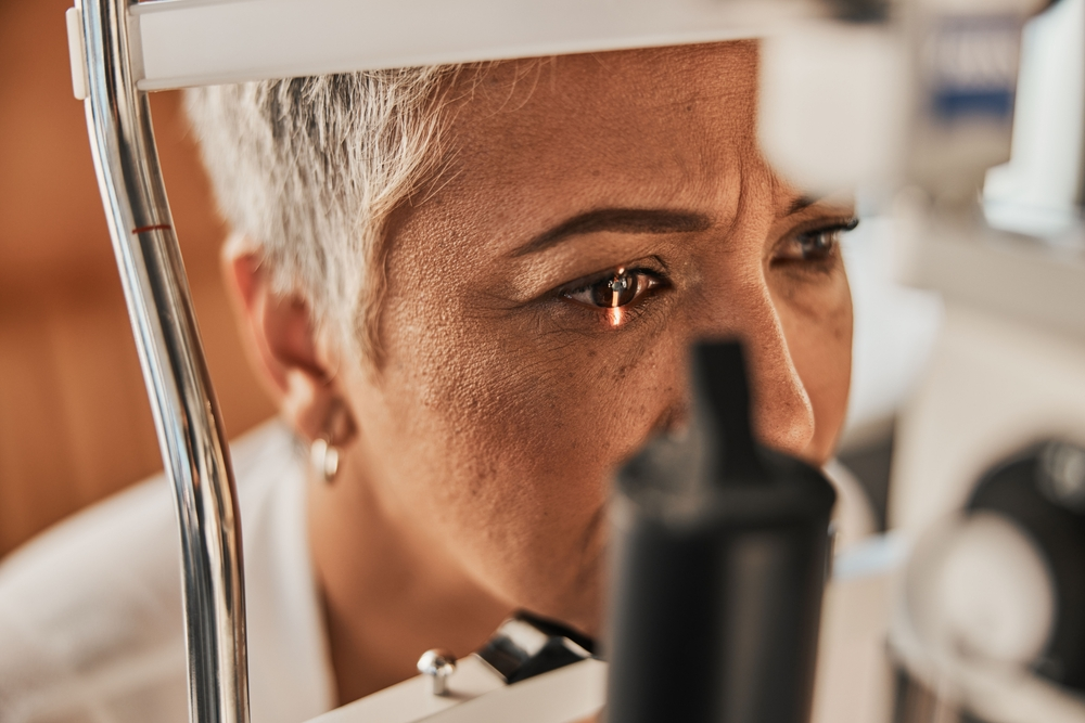 senior woman getting eyes examined