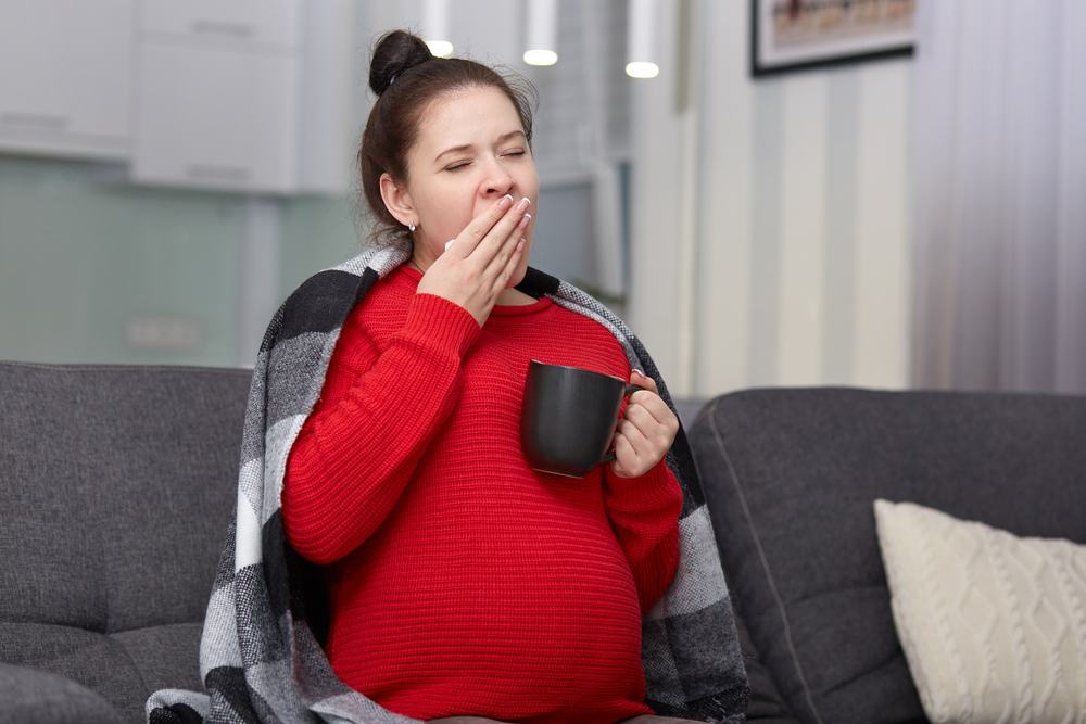 pregnant woman yawning